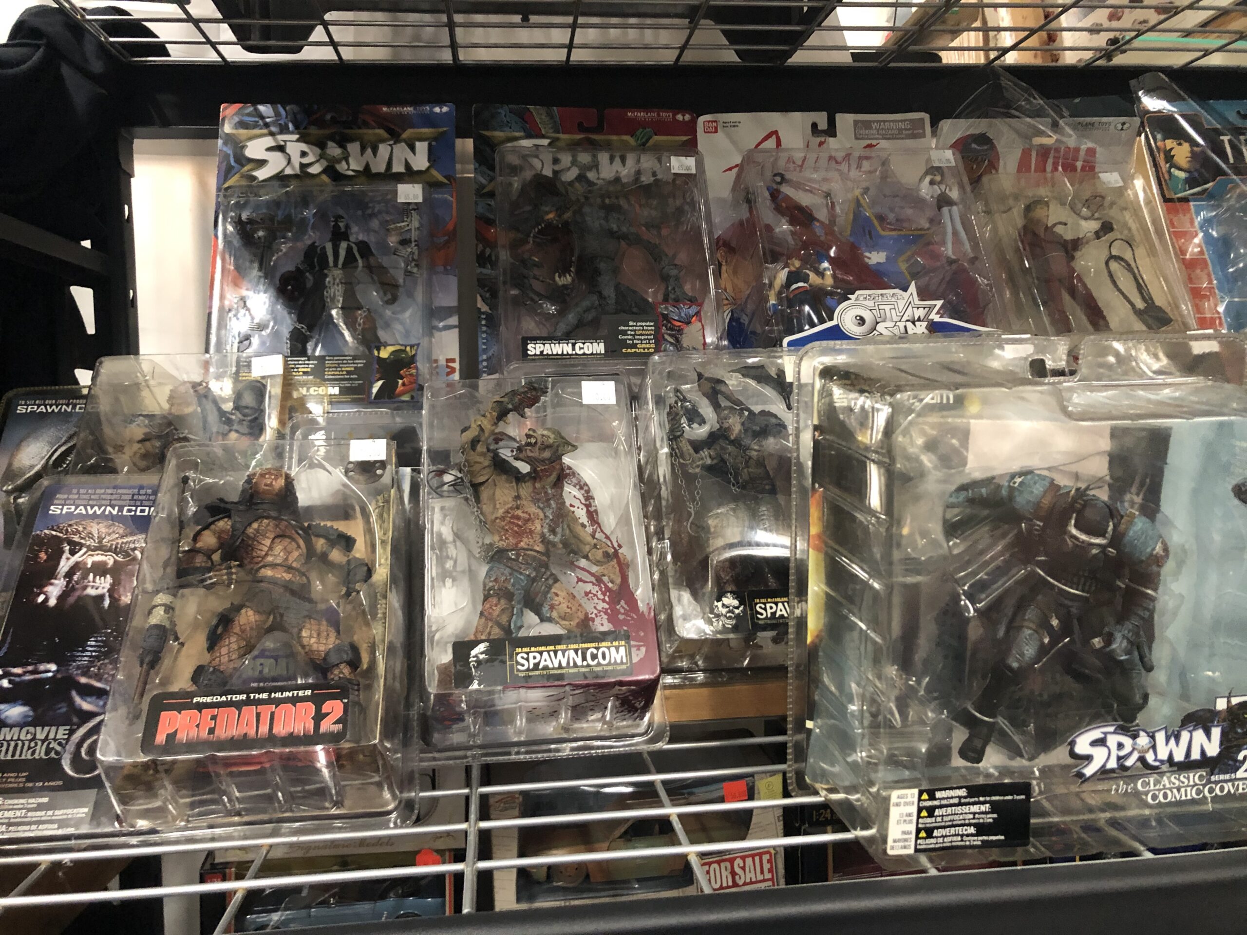 Carded McFarlane Toys Spawn figures hanging on a rack