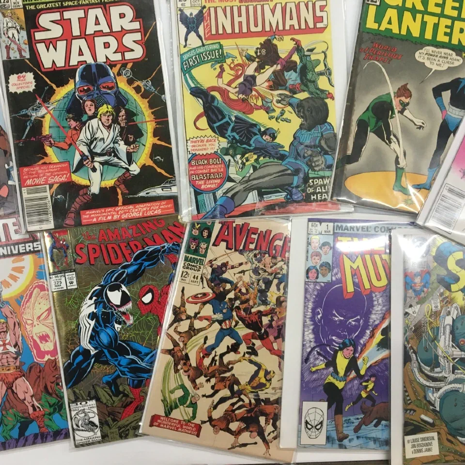A spread of bagged Marvel and DC books — Star Wars, Inhumans, Green Lantern, Spider-Man
